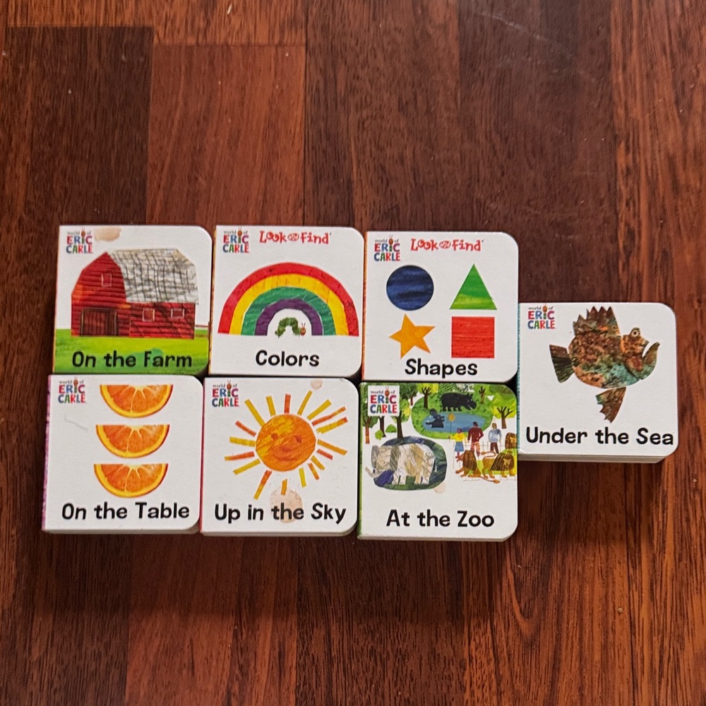 7- 3”x 3” hard cover baby books